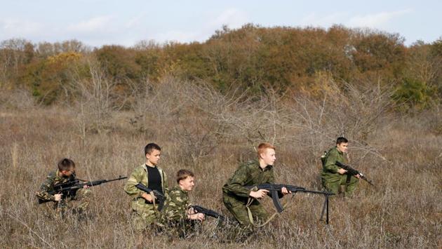 Students from the General Yermolov Cadet School attend a military tactical exercise outside Stavropol, Russia. President Vladimir Putin may be criticised by the West for the annexation of Crimea from Ukraine in 2014 or “The Crimean Spring” as it was hailed by Russian nationalists, but at home the move has led to an upsurge in what is called “military and patriotic education” of Russian youths. (Eduard Korniyenko / REUTERS) Students from the General Yermolov Cadet School attend a military tactical exercise outside Stavropol, Russia. President Vladimir Putin may be criticised by the West for the annexation of Crimea from Ukraine in 2014 or “The Crimean Spring” as it was hailed by Russian nationalists, but at home the move has led to an upsurge in what is called “military and patriotic education” of Russian youths. (Eduard Korniyenko / REUTERS)
