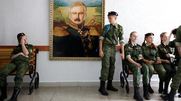 Students seen at the General Yermolov Cadet School next to the portrait of Alexei Yermolov, the famous Russian imperial general. “Tomorrow begins today,” reads the motto of the cadet school that was named after the 19th century general who conquered the Caucasus for the Russian empire. (Eduard Korniyenko / REUTERS) Students seen at the General Yermolov Cadet School next to the portrait of Alexei Yermolov, the famous Russian imperial general. “Tomorrow begins today,” reads the motto of the cadet school that was named after the 19th century general who conquered the Caucasus for the Russian empire. (Eduard Korniyenko / REUTERS)