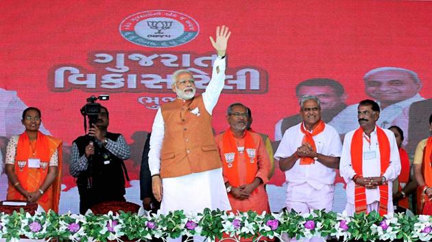 Prime minister Narendra Modi waves at the crowd during a public meeting in support of BJP candidates for Gujarat assembly polls, in Bhuj. (PTI) Prime minister Narendra Modi waves at the crowd during a public meeting in support of BJP candidates for Gujarat assembly polls, in Bhuj. (PTI)