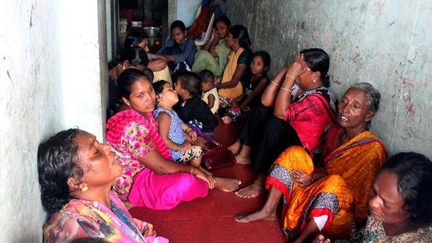 Family members of missing fishermen gather on the shore at Poonthura in Thiruvananthapuram on December 1, 2017. District collector Dr K Vasuki, who is co-ordinating rescue works in Kerala, said at least 40 fishermen are still stranded at sea. (Vivek Nair / HT Photo) 