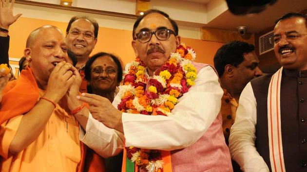 Uttar Pradesh BJP chief Mahendra Nath Pandey offers sweets to chief minister Yogi Adityanath after the party’s victory in the civic boy elections in Lucknow on Friday. (Subhankar Chakraborty/HT Photo) Uttar Pradesh BJP chief Mahendra Nath Pandey offers sweets to chief minister Yogi Adityanath after the party’s victory in the civic boy elections in Lucknow on Friday. (Subhankar Chakraborty/HT Photo)