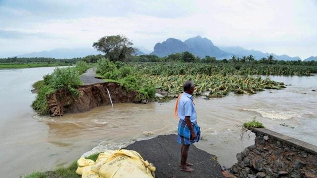 A man watches a road that has been cut off due to floods following heavy rainfall caused by Cyclone Ockhi which caused heavy damage in Kanyakumari district on Saturday. (PTI) A man watches a road that has been cut off due to floods following heavy rainfall caused by Cyclone Ockhi which caused heavy damage in Kanyakumari district on Saturday. (PTI)