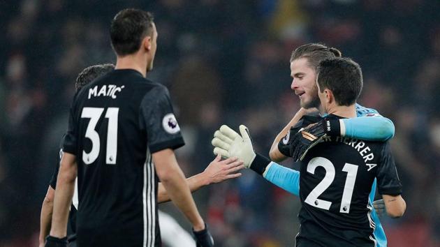 Manchester United players celebrate following their Premier League win over arch rivals Arsenal at the Emirates Stadium in London on Saturday. (AFP) Manchester United players celebrate following their Premier League win over arch rivals Arsenal at the Emirates Stadium in London on Saturday. (AFP)