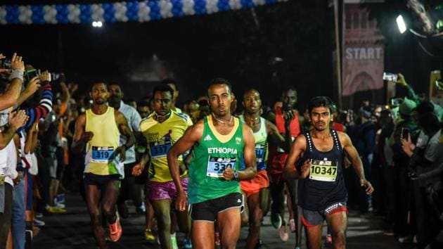 Participants of the men's half-marathon event at the start line of 32nd Pune International Marathon at Sanas Ground in Pune. (Sanket Wankhede/HT Photo) Participants of the men's half-marathon event at the start line of 32nd Pune International Marathon at Sanas Ground in Pune. (Sanket Wankhede/HT Photo)