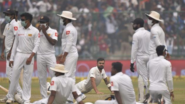 Sri Lankan players complained of uneasiness and wore anti-pollution masks on the field as play got delayed. (PTI) Sri Lankan players complained of uneasiness and wore anti-pollution masks on the field as play got delayed. (PTI)