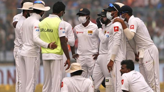 ollution in Delhi temporarily held up play during the 3rd Test between India and Sri Lanka in New Delhi on Sunday. (AP) ollution in Delhi temporarily held up play during the 3rd Test between India and Sri Lanka in New Delhi on Sunday. (AP)