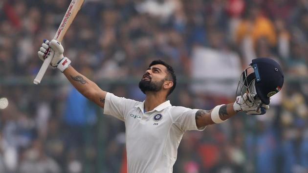 India's captain Virat Kohli celebrates after scoring a double century during the second day of their third Test match against Sri Lanka in New Delhi on Sunday. (AP) India's captain Virat Kohli celebrates after scoring a double century during the second day of their third Test match against Sri Lanka in New Delhi on Sunday. (AP)