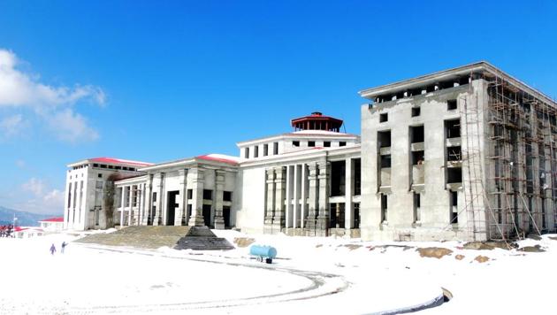 The snow-covered state assembly building at Bhararisain near Gairsain in Chamoli district, where winter session is set to begin on December 7. (HT File Photo) The snow-covered state assembly building at Bhararisain near Gairsain in Chamoli district, where winter session is set to begin on December 7. (HT File Photo)