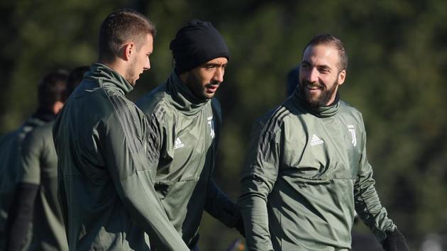 Juventus players take part in a training session on the eve of their UEFA Champions League match Olympiacos. (AFP) Juventus players take part in a training session on the eve of their UEFA Champions League match Olympiacos. (AFP)