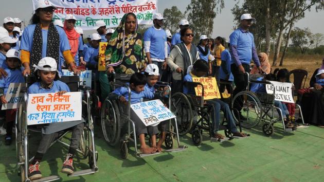 Victims of Bhopal gas tragedy take part in a walk organized to mark World Disability Day in Bhopal. Three decades on, children born to those exposed to lethal gas during the disaster are still born with various physical deformities in what is today known as one of the worst Industrial disasters in the world. (Mujeeb Faruqui/HT Photo)