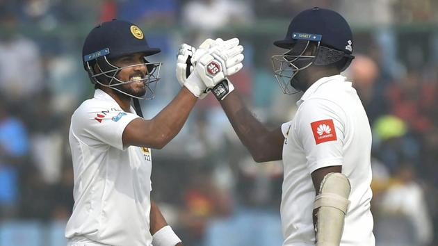 Dinesh Chandimal and Angelo Mathews scored a century each for Sri Lanka against India on the third day of the final Test at the Feroz Shah Kotla. Catch full cricket score of the 3rd Test between India vs Sri Lanka, third day here.(PTI)