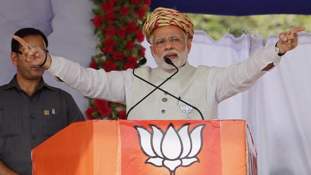 Prime Minister Narendra Modi speaks during an election campaign rally at Surendranagar in Gujarat on Sunday.(AP)