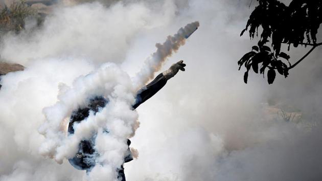 A demonstrator returns a tear gas grenade while clashing with riot police during a rally in Caracas. Having failed to block the Constituent Assembly, opposition supporters decided to tackle Maduro at the ballot-box in regional elections in October, but that backfired when they lost most of the governorships despite polls predicting wins. The opposition alleged fraud, but their complaints did not get traction as Maduro cemented his authority. (Carlos Garcia Rawlins / REUTERS) A demonstrator returns a tear gas grenade while clashing with riot police during a rally in Caracas. Having failed to block the Constituent Assembly, opposition supporters decided to tackle Maduro at the ballot-box in regional elections in October, but that backfired when they lost most of the governorships despite polls predicting wins. The opposition alleged fraud, but their complaints did not get traction as Maduro cemented his authority. (Carlos Garcia Rawlins / REUTERS)