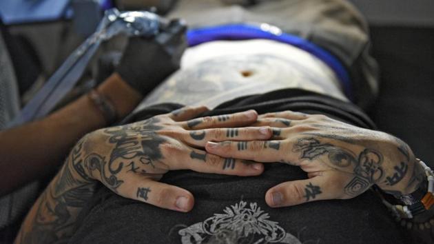 A festival attendee gets inked during the third edition of the Heartwork festival. (Burhaan Kinu / HT PHOTO)