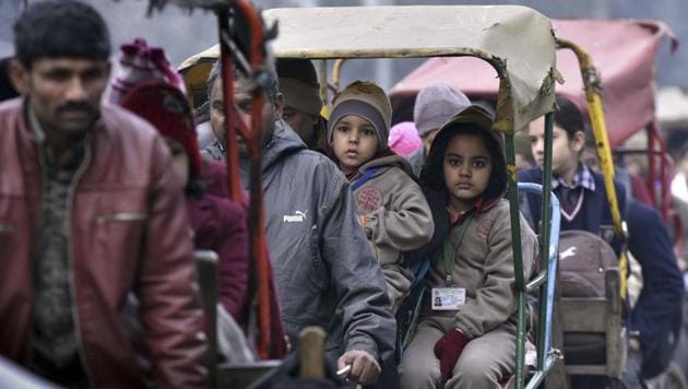 School children travel to school in a cycle rickshaw on a cold winter morning in old Delhi, India on January 16, 2017. (HT File Photo) School children travel to school in a cycle rickshaw on a cold winter morning in old Delhi, India on January 16, 2017. (HT File Photo)