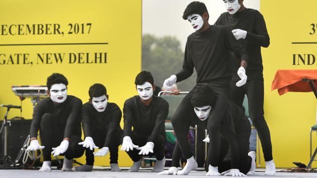 Mime artists from Hyderabad perform to mark World Disability Day at India Gate in New Delhi. The day is observed to increase awareness of gains to be derived from the integration of persons with disabilities in every aspect of political, social, economic and cultural life. (Sushil Kumar/HT PHOTO)