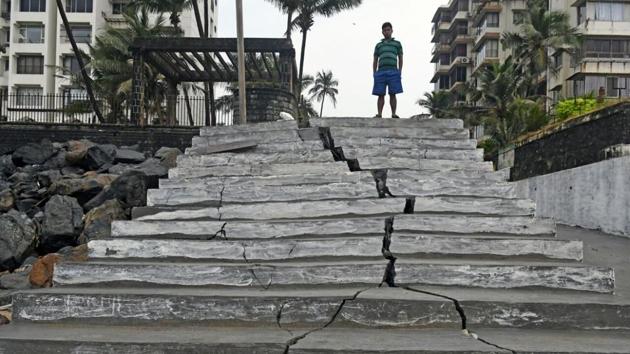 A newly built staircase at Versova was damaged because of strong waves and high tides on Monday night. (Shashi Kashyap/HT)