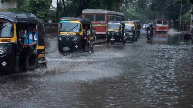 Vehicles wade through a waterlogged street in Versova, Mumbai. According to IMD officials, “It is moving further north-north-eastwards. It will weaken gradually into a deep depression by Tuesday night as it reaches the north Maharastra coast. (Satish Bate / HT Photo) Vehicles wade through a waterlogged street in Versova, Mumbai. According to IMD officials, “It is moving further north-north-eastwards. It will weaken gradually into a deep depression by Tuesday night as it reaches the north Maharastra coast. (Satish Bate / HT Photo)