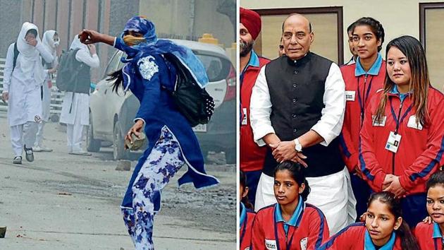 Afshan Ashiq, who once pelted stones during a protest in the Valley, stands on the left of Union home minister Rajnath Singh in New Delhi on Tuesday.(PTI Photo)