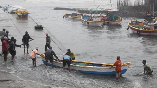 Fisherman pull their boats as Cyclone Ockhi strikes Worli, Mumbai. (Bhushan Koyande/HT File Photo) Fisherman pull their boats as Cyclone Ockhi strikes Worli, Mumbai. (Bhushan Koyande/HT File Photo)