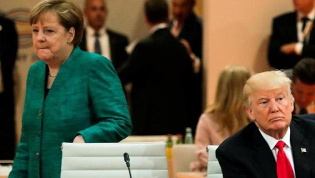 US President Donald Trump, front right, and German Chancellor Angela Merkel, left, at a working session at the G-20 summit in Hamburg, Germany. (Reuters)