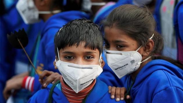 Children wearing masks attend a demonstration to spread awareness on the problem of air pollution in New Delhi.(PTI File Photo)