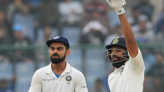 Virat Kohli (L) and Rohit Sharma (R) gesture towards the dressing room during the fourth day of the third Test cricket match between India and Sri Lanka. (AFP) Virat Kohli (L) and Rohit Sharma (R) gesture towards the dressing room during the fourth day of the third Test cricket match between India and Sri Lanka. (AFP)