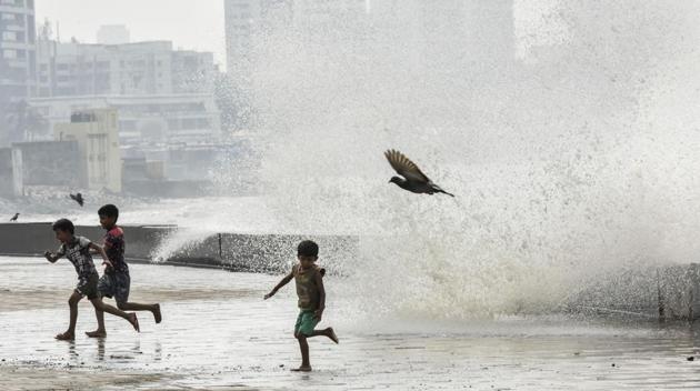 Children run from high tide caused by cyclone Ockhi at Worli Seaface in Mumbai. (Kunal Patil / HT Photo) Children run from high tide caused by cyclone Ockhi at Worli Seaface in Mumbai. (Kunal Patil / HT Photo)