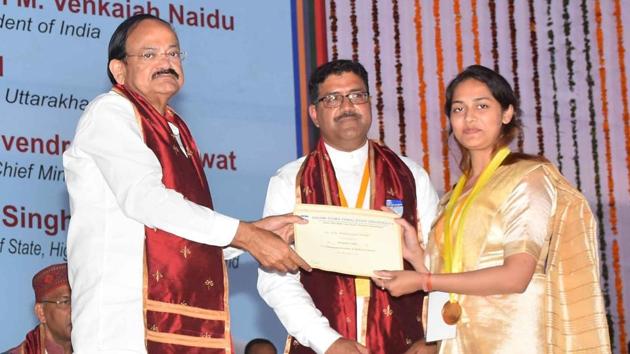 Vice president M Venkaiah Naidu presents degree to a student at the Swami Ram Himalayan University in Dehradun on Tuesday. (HT Photo) Vice president M Venkaiah Naidu presents degree to a student at the Swami Ram Himalayan University in Dehradun on Tuesday. (HT Photo)