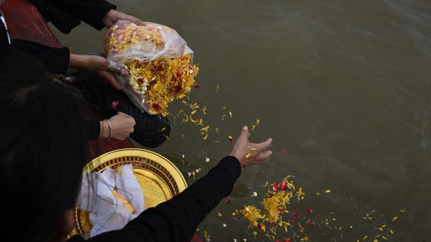 A family of mourners releases flowers with the bones and ashes of their beloved pet dog into the Chaopraya river in Bangkok. For pet lovers, the service provides spiritual succour at a time of great pain. At the end of a funeral ceremony of her Siberian husky Maprang, a teary-eyed Tipaporn Ounsiri said, “If the next life exists, please come back and be my daughter, don’t be born as a pet anymore”. (Lillian Suwanrumpha / AFP)