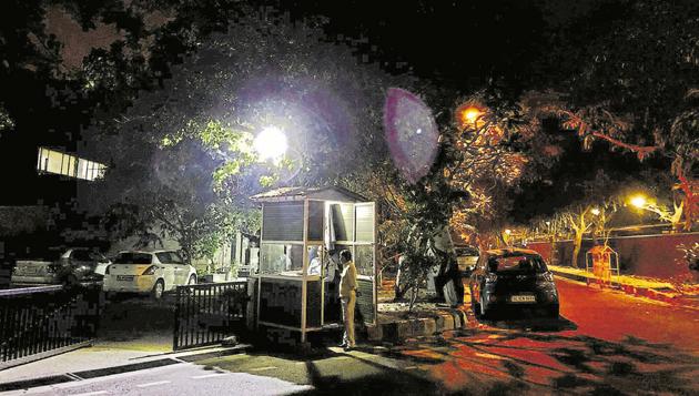 The busy Max Mueller avenue is a quiet place at night, with no one apart from surreal shadows and some guards.(Mayank Austen Soofi / HT Photo)