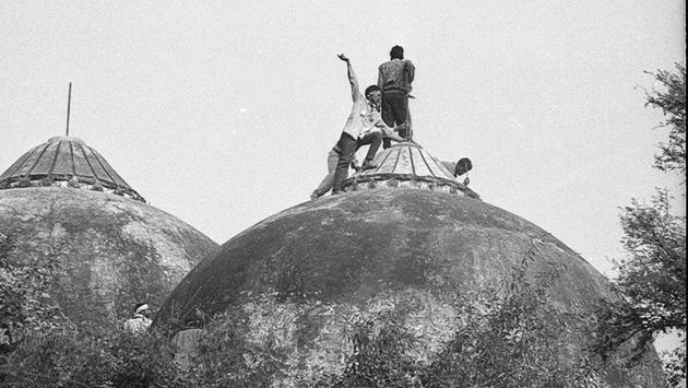 File photo of people climbing the Babri Masjid in Ayodhya on the day it was demolished. (Sanjay Sharma/HT Archive) File photo of people climbing the Babri Masjid in Ayodhya on the day it was demolished. (Sanjay Sharma/HT Archive)