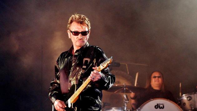 This file photo taken on May 25, 2003 shows French singer Johnny Hallyday performing in Saint-Denis-de-la-Réunion France's best-known rock star Johnny Hallyday has died aged 74 after a battle with lung cancer.(AFP)