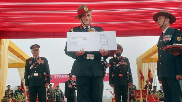 Army chief General Bipin Rawat presenting the President’s Standard to 87 Armoured regiment, 41 Armoured regiment and 10 Armoured regiment in Suratgarh Military Station on Tuesday.(PTI Photo)