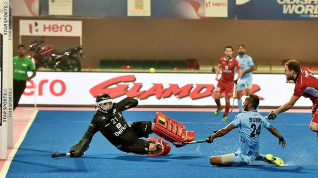 Indian men’s hockey team player SV Sunil (24) attempts to score against Belgium during the second quarter of their quarterfinal match of the FIH Hockey World league Final at Kalinga Stadium in Bhubaneswar on Wednesday. Get highlights of the FIH Hockey World League Final, India vs Belgium quarterfinal here.(PTI)