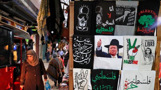 A T-shirt bearing an image of US President Donald Trump dressed as a Hasidic Jew is displayed in a souvenir shop in Jerusalem’s Old City on December 4, 2017. American officials who previewed the announcement claimed they didn’t expect the peace process to be impacted and that considerable progress had been achieved by the team working on it — led by Trump’s son-in-law Jared Kushner. (Ahmad Gharabli / AFP) 
