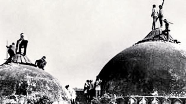 Karsevaks atop the Babri Masjid in December 1992.(File photo)