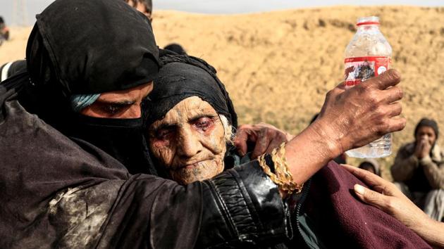90-year-old Khatla Ali Abdallah after she fled; her fearful eyes red with fatigue so severe she could not stand or even sit properly. Even as an alliance of convenience was struck, offensives posed formidable physical obstacles. Key districts consisted of ancient streets and alleyways inaccessible to armoured vehicles and were so densely populated air strikes risked heavy civilian casualties making street by street, house by house, fighting unavoidable. (Zohra Bensemra / REUTERS)