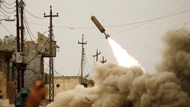 Iraqi rapid response members fire a missile against Islamic State militants during a battle with the militants in Mosul. As much of east and west Mosul was pulverised by coalition air strikes, the city was reduced to row after row of collapsed or gutted housing. In the end, IS suffered its most decisive defeat and watched their self-proclaimed caliphate evaporate in Iraq, then in Syria as Kurdish-led forces retook Raqqa --IS’s urban stronghold there. (Thaier Al-Sudani / REUTERS)