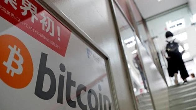 A logo of Bitcoin is seen on an advertisement of an electronic shop in Tokyo on September 5, 2017. (Reuters) A logo of Bitcoin is seen on an advertisement of an electronic shop in Tokyo on September 5, 2017. (Reuters)