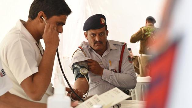 A traffic policeman gets his blood pressure checked during the camp. A cross-section of policemen, HT spoke to at the camp said fear for their safety caused the majority of their stress. They added that the demanding schedule and Delhi’s pollution in the recent weeks has also played a major role in aggravating the situation. (Raj K Raj / HT Photo) A traffic policeman gets his blood pressure checked during the camp. A cross-section of policemen, HT spoke to at the camp said fear for their safety caused the majority of their stress. They added that the demanding schedule and Delhi’s pollution in the recent weeks has also played a major role in aggravating the situation. (Raj K Raj / HT Photo)