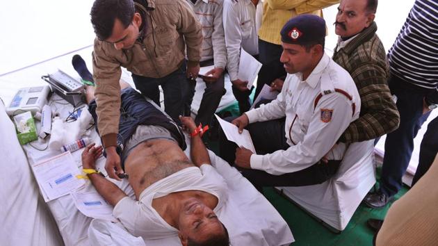A traffic police personnel undergoes a check-up at the headquarters in Todarpur. Dr Sunny Kalra from BLK Super Speciality Hospital, who conducted these health check-ups, said most of the policemen reported that long hours in hazardous work conditions were taking a toll on their physical and mental health. (Raj K Raj / HT Photo) A traffic police personnel undergoes a check-up at the headquarters in Todarpur. Dr Sunny Kalra from BLK Super Speciality Hospital, who conducted these health check-ups, said most of the policemen reported that long hours in hazardous work conditions were taking a toll on their physical and mental health. (Raj K Raj / HT Photo)