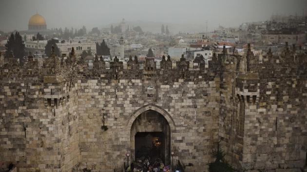 In this Feb. 19, 2009 photo, people walk in and out of the Damascus gate, while the Dome of the Rock, background and left, is seen on a cloudy, overcast day in Jerusalem's Old City. (AP) In this Feb. 19, 2009 photo, people walk in and out of the Damascus gate, while the Dome of the Rock, background and left, is seen on a cloudy, overcast day in Jerusalem's Old City. (AP)