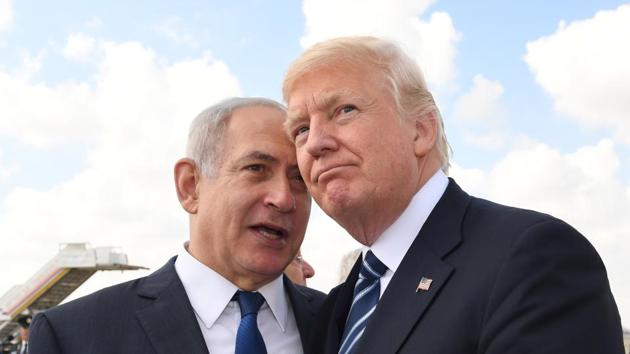 Israeli PM Benjamin Netanyahu and US President Trump prior to the latter’s departure from Tel Aviv on May 23, 2017. On the campaign trail, Trump took a strongly pro-Israel stance, promising to relocate the US Embassy from Tel Aviv to Jerusalem. Under American law, the president must sign a waiver every six months that leaves the embassy in Tel Aviv. In June, Trump renewed the waiver. This week, another six-month deadline passed without Trump renewing it. (Kobi Gideon / GPO via Getty Images) 