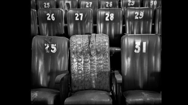 Untitled #5 (Natraj), 2009. Inkjet Print. Inside the Natraj theatre in Varanasi, Raman photographed rows of seats, where one stands out for its odd, replaced upholstery, again marking the struggle for the old to hold its own against the new and ultimately revealing the passage of time. (Courtesy Nandita Raman and sepiaEYE)