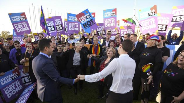 Same-sex marriage campaigners and volunteers cheer as they call on politicians to pass marriage equality legislation during rally outside Parliament House in Canberra, Australia. (AP Photo) Same-sex marriage campaigners and volunteers cheer as they call on politicians to pass marriage equality legislation during rally outside Parliament House in Canberra, Australia. (AP Photo)