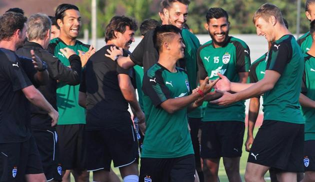 Bengaluru FC captain Sunil Chhetri shares a light moment with teammates during a practice session for their Indian Super League (ISL) match against NorthEast United FC at the Indira Gandhi National Athletic Stadium in Guwahati on Thursday. (PTI) Bengaluru FC captain Sunil Chhetri shares a light moment with teammates during a practice session for their Indian Super League (ISL) match against NorthEast United FC at the Indira Gandhi National Athletic Stadium in Guwahati on Thursday. (PTI)