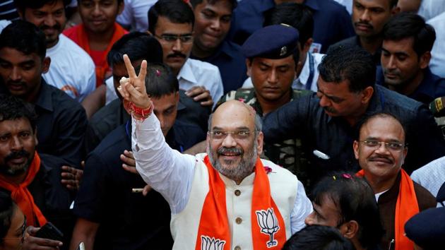 BJP chief Amit Shah gestures as he goes on a door-to-door campaign at a residential area for the upcoming Gujarat state assembly elections, in Ahmedabad. (Reuters File) BJP chief Amit Shah gestures as he goes on a door-to-door campaign at a residential area for the upcoming Gujarat state assembly elections, in Ahmedabad. (Reuters File)