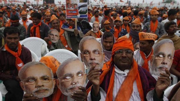 Supporters of Prime Minister Narendra Modi hold his masks during an election campaign rally at Dhandhuka in Gujarat. (AP Photo) Supporters of Prime Minister Narendra Modi hold his masks during an election campaign rally at Dhandhuka in Gujarat. (AP Photo)
