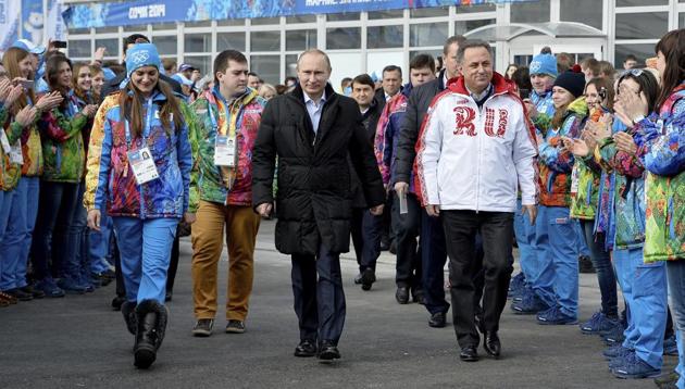 In this Feb. 5, 2014 file photo Russian President Vladimir Putin, center, visits the Olympic Athletes Village in Coastal Cluster ahead of the Sochi 2014 Winter Olympics with Olympic Village Mayor Elena Isinbaeva, left, and Russian Minister of Sport, Tourism and Youth policy Vitaly Mutko in Sochi.(AP)